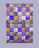 Patchwork quilt with various floral and mauve patterns on a grey background