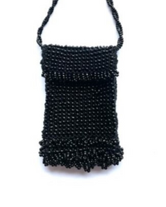 Black beaded handbag on a white background