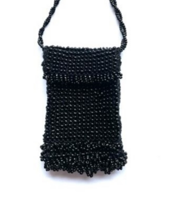 Black beaded handbag on a white background