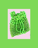 Green beaded pouch bag on a cream background with green border