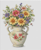 Cross-stitched pattern of a vase with flowers on a grid background
