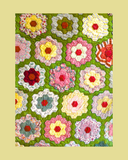 Colourful flower pattern on a green background Grandmother's flower garden quilt