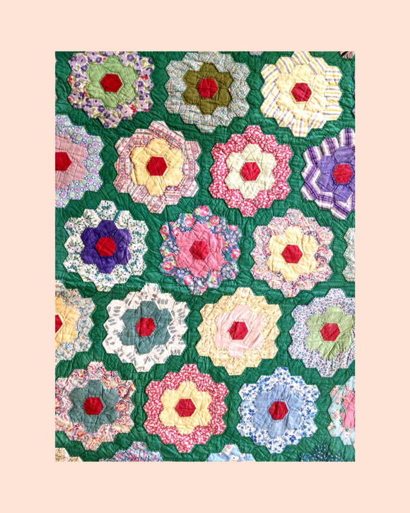 Colourful Grandmother's flower garden patterned fabric Kit on a green background