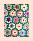 Colourful Grandmother's flower garden patterned fabric Kit on a green background