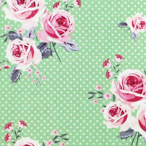 Gutermann floral pattern with pink roses on a green background with white polka dots