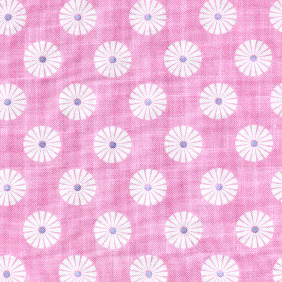 Gutermann fabric with white floral daisy patterns with blue centres on a pink background