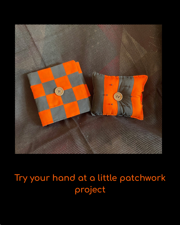 Halloween Pin Cushion and Needle Holder Set Two small checkered fabric pieces with buttons on a textured surface,  encouraging a patchwork project.
