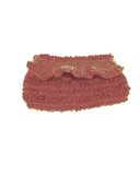 Dusty pink beaded clutch purse on a white background