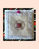Bead Embroidered fabric with floral design on a striped background