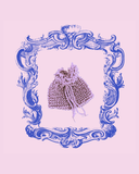Decorative blue frame with a purple beaded pouch on a light purple background