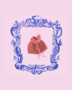 Pink knitted and beaded pouch with a decorative blue frame on a pink background