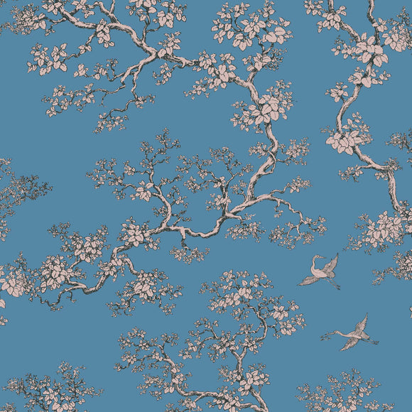 Cherry blossom patterned cotton fabric with branches and cranes on a blue background