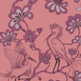 Decorative pattern of cranes and flowers on a pink background