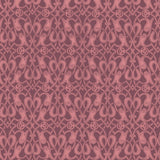 Patterned fabric with intricate design on a dusty pink mauve background