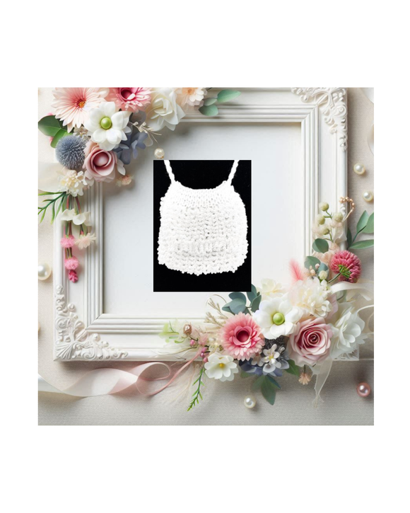 White beaded necklace displayed in a decorative wedding frame with floral elements on a white background