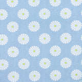 Gutermann fabric with pattern of white flowers with yellow centres on a blue background
