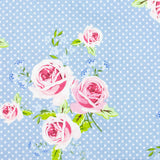 Floral Gutermann pattern with pink roses on a blue background with white polka dots