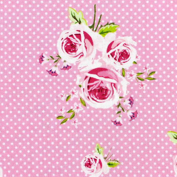 Pink floral roses design by Gutermann with white polka dots on a pink background