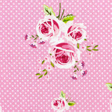 Pink floral roses design by Gutermann with white polka dots on a pink background