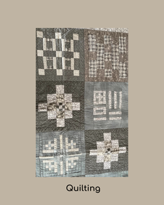 Quilt with geometric pattern on a grey background