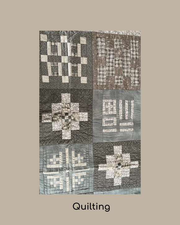 Quilt with geometric pattern on a grey background