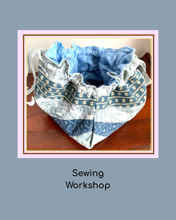 Fabric with decorative patterns on a wooden surface, labeled 'Sewing Workshop'.