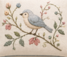Decorative needlepoint with a bird and floral pattern