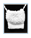 White beaded bag on a black background