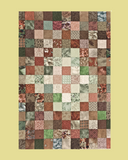 Patchwork quilt with various patterns and colours on a beige and brown background
