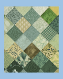 Patchwork quilt with grey and blue  squares on a light blue background