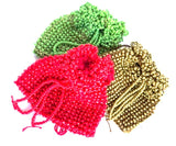 Christmas set of beaded pouches, red, green, gold on a white background